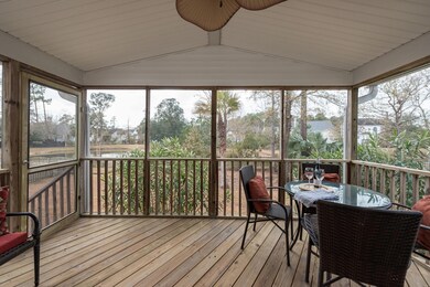 Screened porch overlooking pond and yard
