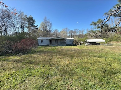 View of yard with a detached carport