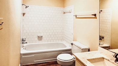 Inviting full bathroom featuring clean, white tile