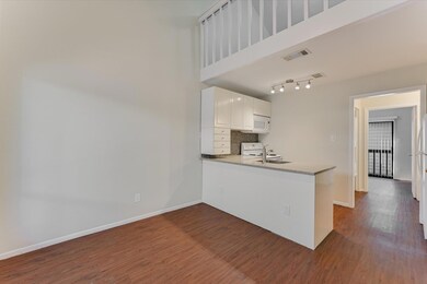 Kitchen featuring a peninsula, dark wood finished