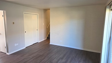 Exposed brick, new LVP flooring, and completely pa