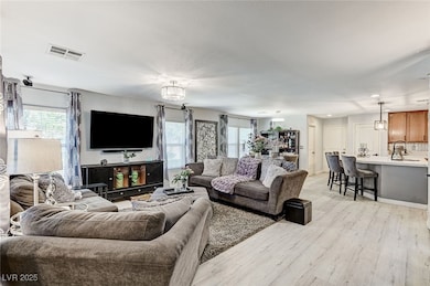 Living room with light wood-type flooring