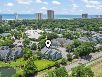 Aerial perspective of suburban area featuring a large body of water