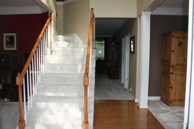 Entering in the front door, to your right is your formal living area and to your left is your formal dining area. 