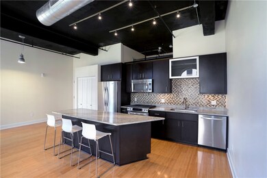 View of kitchen, island with seat up to 4, and coa