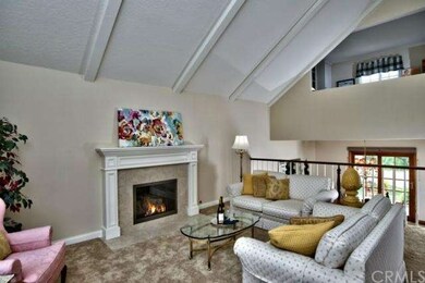 Formal Living Room has Fireplace with Custom Mantl