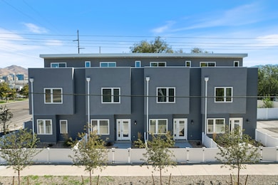 Modern home featuring a fenced front yard + rooftop decks.