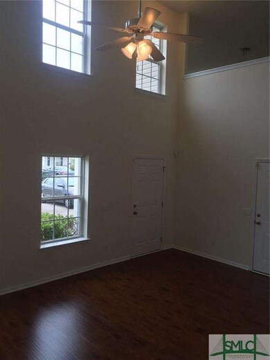 Large Living Room With Extra Windows for Lots of N