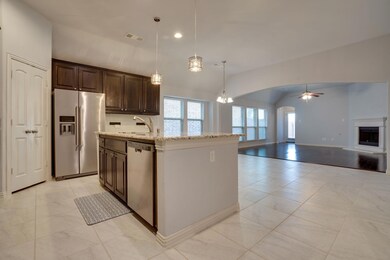 Kitchen with a center island with sink, stainless 