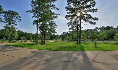 View of the large front yard. Lots of space to roam with this yard. A view of the putting greens and landscaped common area with waterfall across the street. No neighbor across the street from this house!