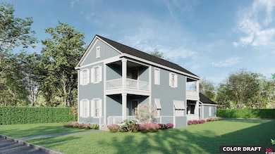 Back of property with a yard and a balcony