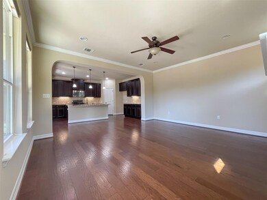 Unfurnished living room featuring dark wood finis