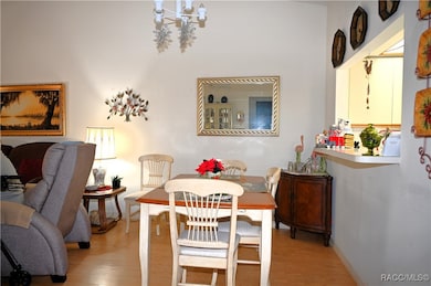 Dining is next to pass-through from kitchen.