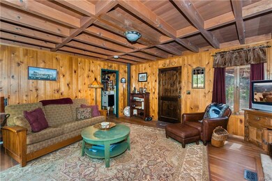 Notice the knotty pine paneling and original wood flooring; lovingly cared for over the years.