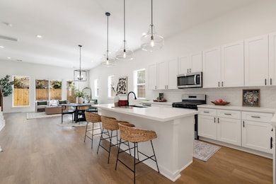 As you walk into the home, you’re immediately greeted by an open-concept layout filled with natural light.