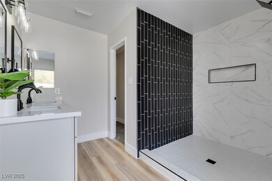 Full bathroom featuring a sink, visible vents, til