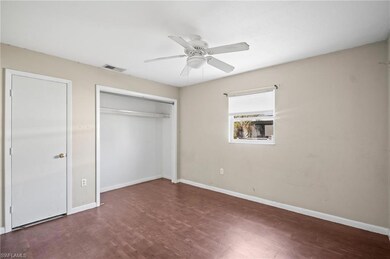 Unfurnished bedroom featuring a closet, baseboards