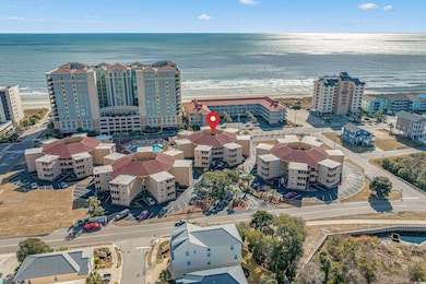 Drone / aerial view with a water view and a beach 