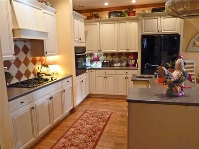 Cooks gourmet kitchen with ample...