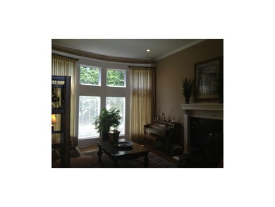 Floor to ceiling windows in living room and firepl