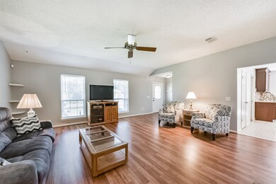 Bright and spacious living room with wood flooring