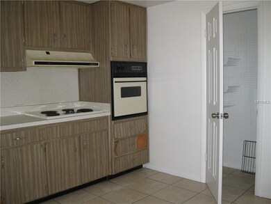 Kitchen showing stove top, hood, built-in oven and
