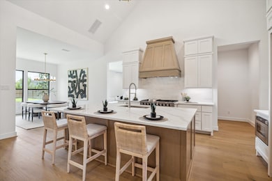 Chef's Kitchen with custom-built cabinetry, quartz