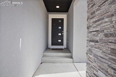 Property entrance with stucco siding