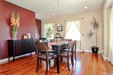 Beautifully refinished hardwood floors set the ton