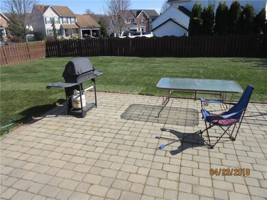 patio, large level, flat fenced rear yard.