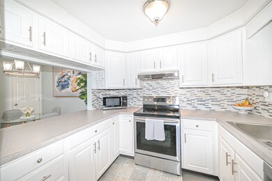 White Cabinets & Subway Tile Backsplash in Kitchen