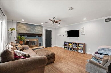 Second living room with fireplace off kitchen