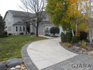 Circle drive leads up to the entry and garage.  Wo