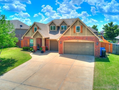 Craftsman-style home featuring driveway, roof with