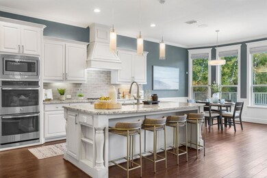 Kitchen has granite counters, a large center islan