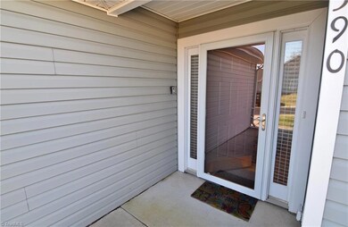 Enjoy a covered front entry porch.  Notice the easy care vinyl siding.