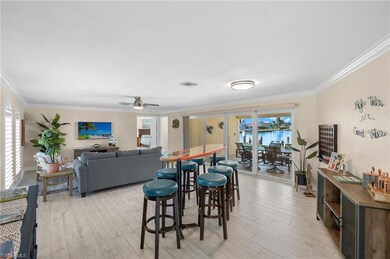 Dining area featuring crown molding, ceiling fan, 