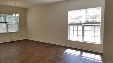 Another view of the living/dining space.  Windows 