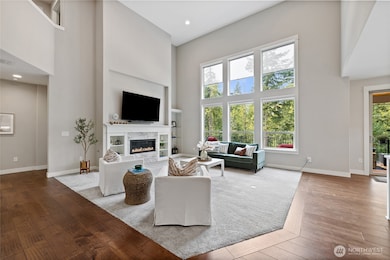 Floor to Ceiling Windows that face Greenbelt with Custom Remote Operated Blinds