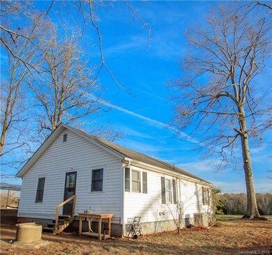 Rear view of home with outdoor sink to clean your 