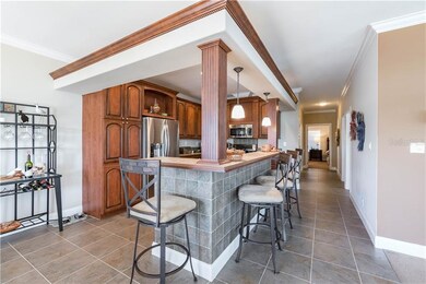 Kitchen with breakfast bar, solid wood cabinets, a