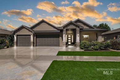 View of front of house with stucco siding, stone siding, a garage, and concrete driveway