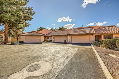 View of front of house with stucco siding, a tiled