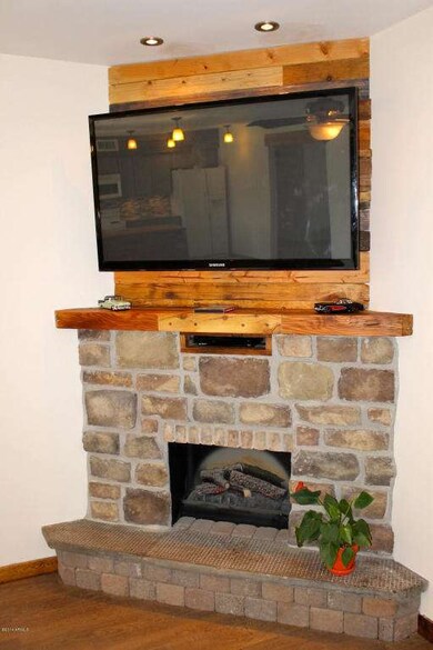 Custom Gas Fireplace With Stone & Lumber