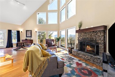 Living room featuring a fireplace, hardwood / wood