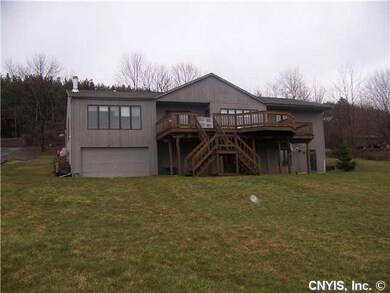Exterior Back Many windows & large deck for relaxi