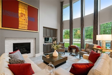 This spacious living room features high ceilings,