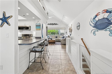 View of kitchen and living area taken from the din
