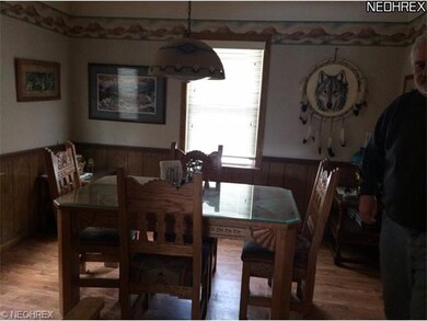 Lovely dining room offers chair rail, wainscoting 
