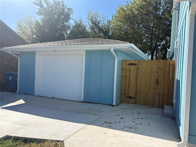 Detached garage featuring driveway
